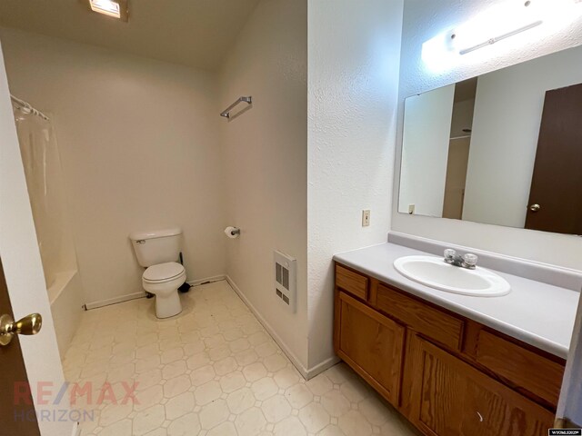 bathroom with tile patterned floors, vanity, baseboards, toilet, and visible vents