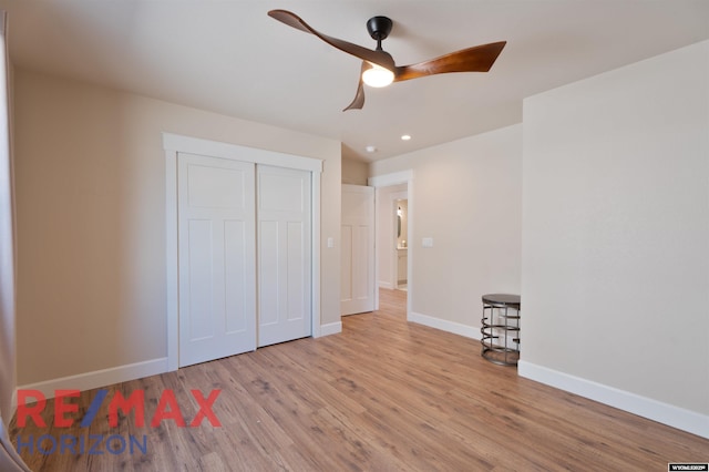 unfurnished bedroom with wood finished floors, a closet, ceiling fan, baseboards, and recessed lighting