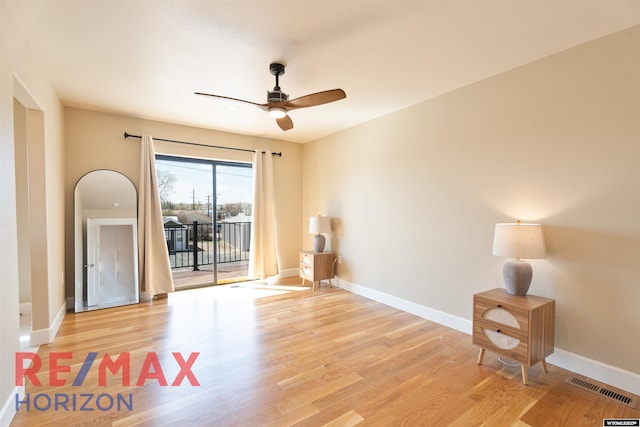 spare room with ceiling fan, baseboards, and visible vents