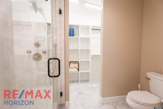 full bathroom with baseboards, marble finish floor, a shower stall, and toilet