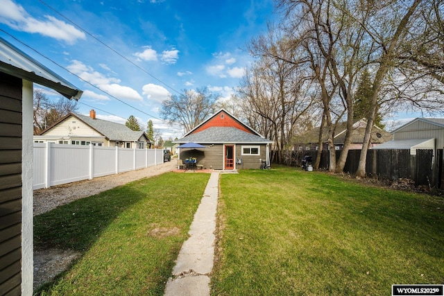 view of yard with a fenced backyard and a patio area