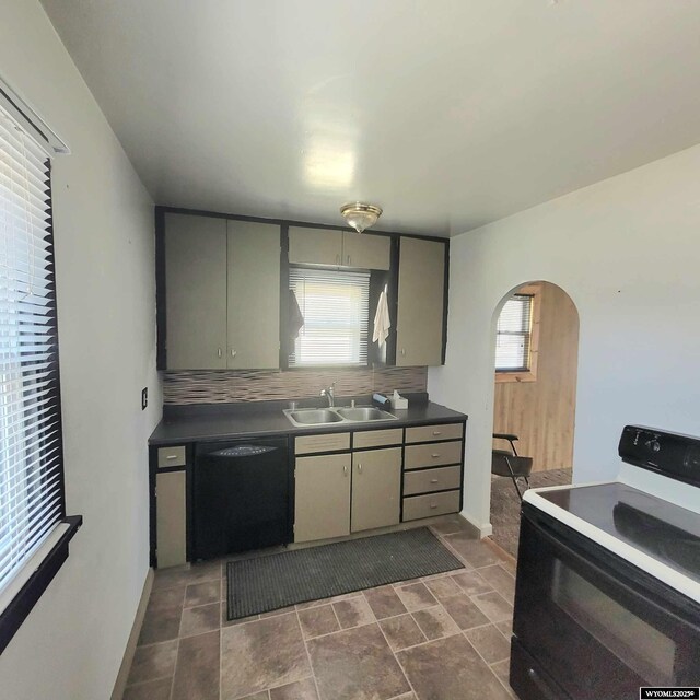 kitchen featuring tasteful backsplash, arched walkways, range with electric stovetop, black dishwasher, and a sink