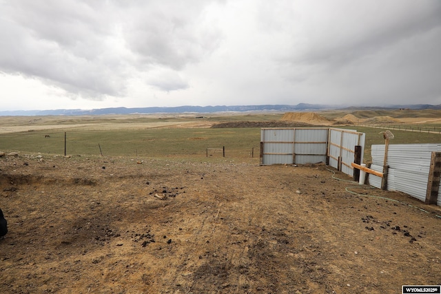 view of yard featuring an outbuilding and a rural view
