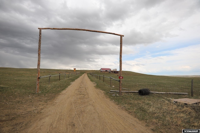 view of road with driveway and a rural view