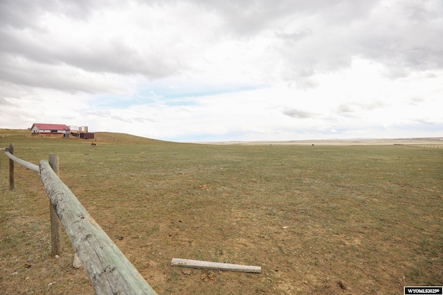 view of yard with a rural view