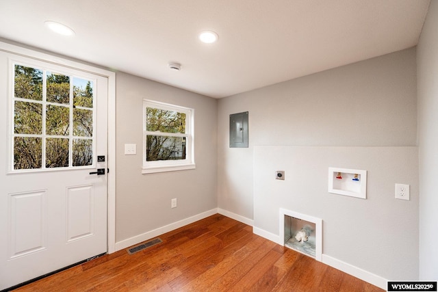 laundry room featuring hookup for an electric dryer, washer hookup, visible vents, wood finished floors, and laundry area
