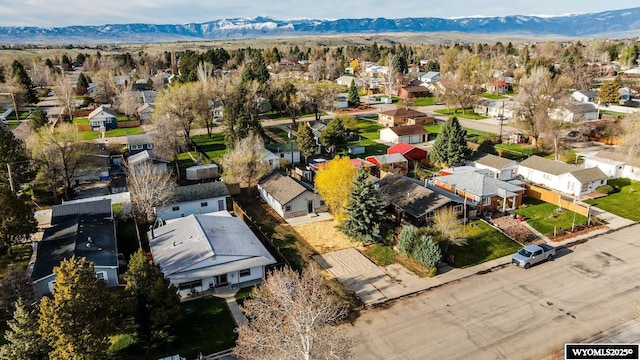 drone / aerial view featuring a residential view and a mountain view