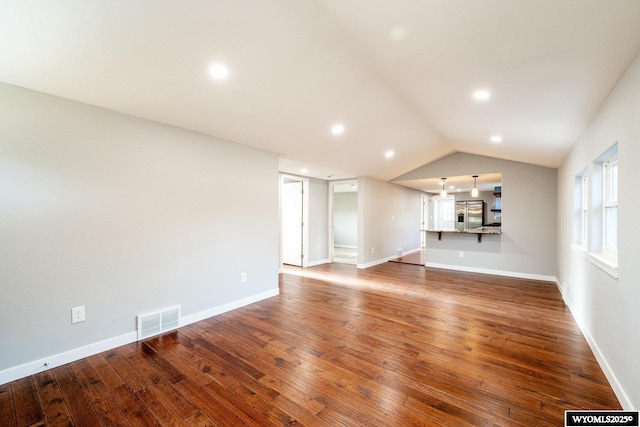 1324 Lewis St, Sheridan, WY 82801 - unfurnished living room featuring visible vents, recessed lighting, vaulted ceiling, and wood-type flooring