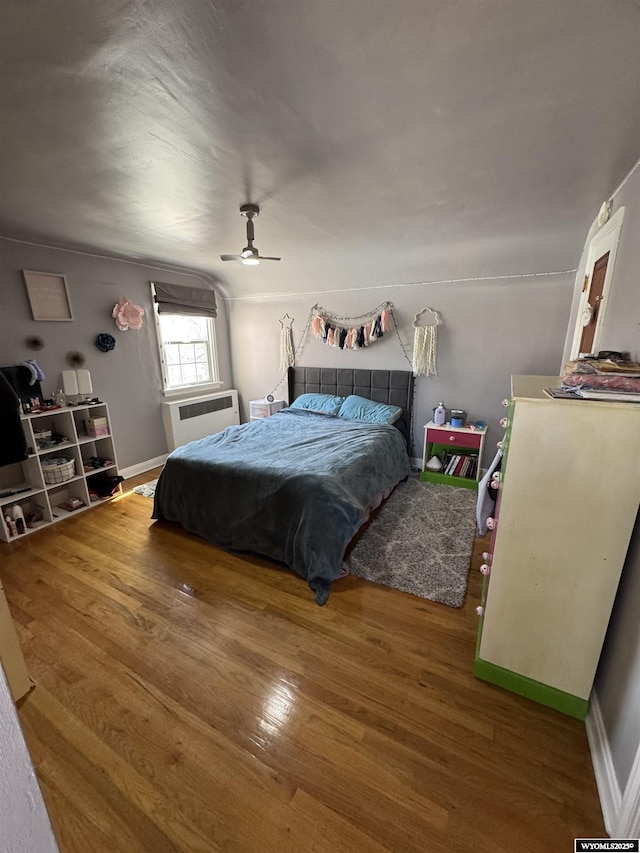 716 B St, Rock Springs, WY 82901 - bedroom with a ceiling fan, wood finished floors, and baseboards