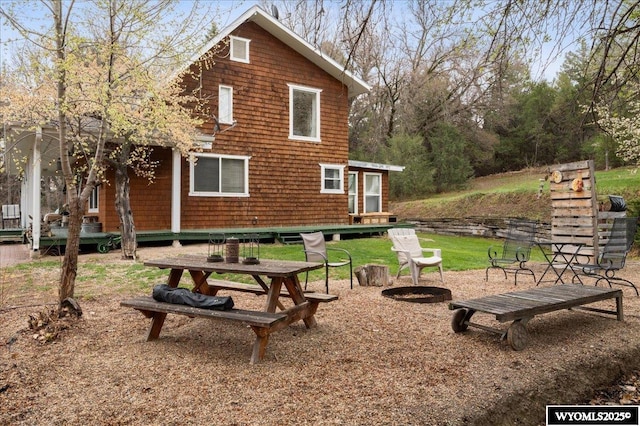 exterior space featuring an outdoor fire pit