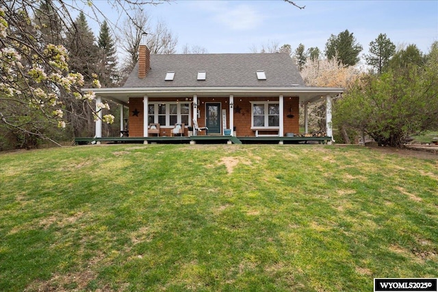farmhouse with a porch, a front lawn, and a chimney