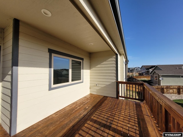 wooden terrace with a residential view