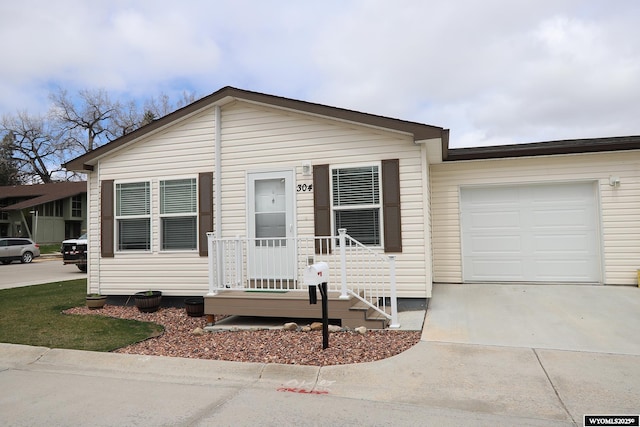 view of front facade with an attached garage and concrete driveway