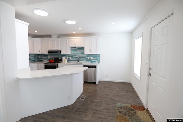 kitchen featuring backsplash, visible vents, appliances with stainless steel finishes, light countertops, and white cabinetry