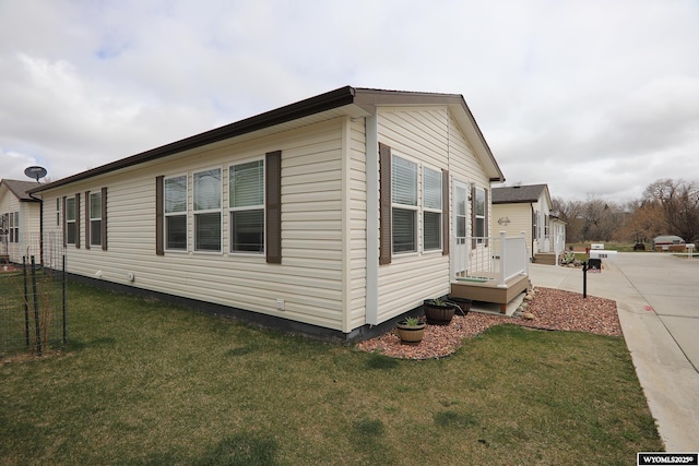 view of home's exterior featuring a lawn