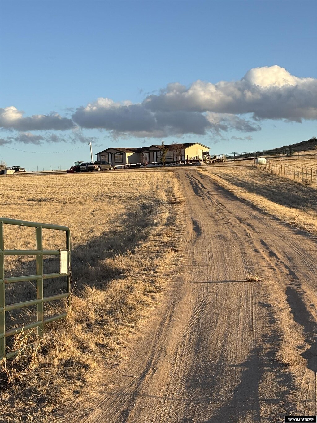 36 Rocky Rd, Douglas, WY 82633 - view of road featuring a rural view, a gated entry, and driveway
