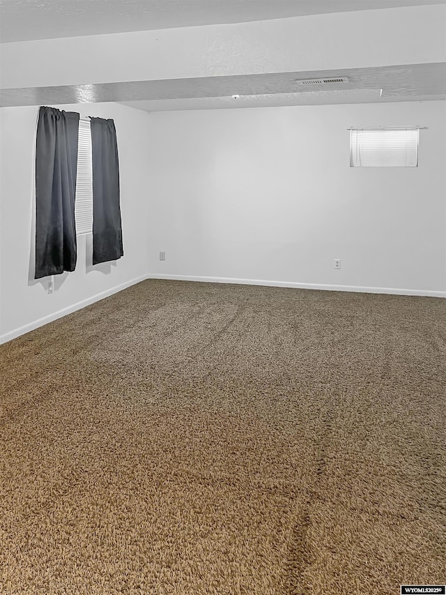 336 Emerson Ave, Evanston, WY 82930 - empty room with baseboards, carpet floors, and visible vents
