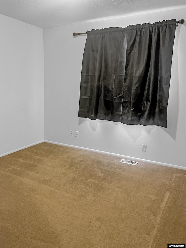 336 Emerson Ave, Evanston, WY 82930 - carpeted spare room featuring visible vents and baseboards