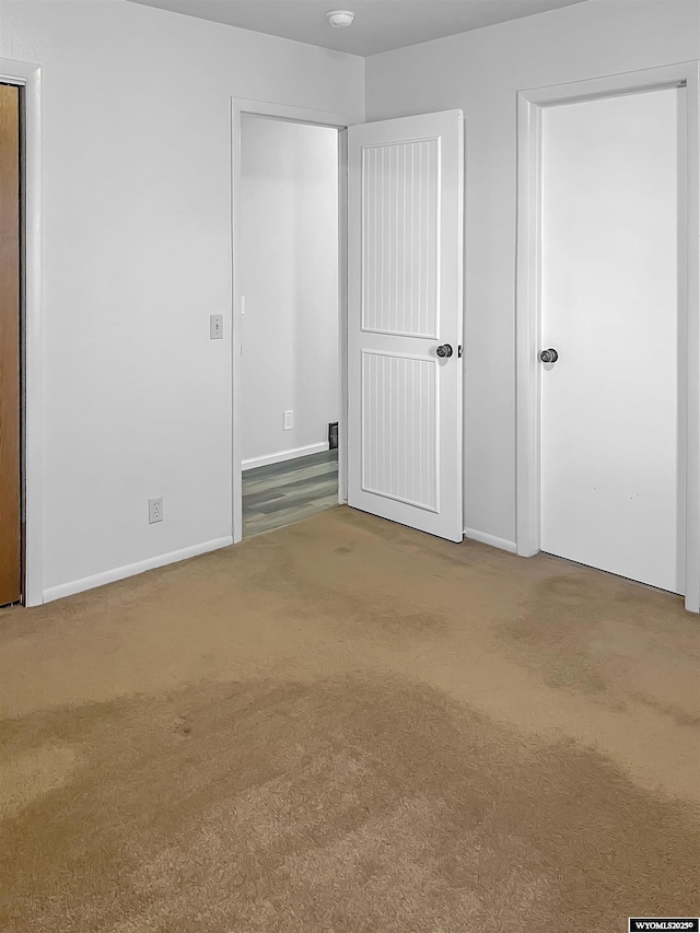 336 Emerson Ave, Evanston, WY 82930 - unfurnished bedroom featuring baseboards and carpet