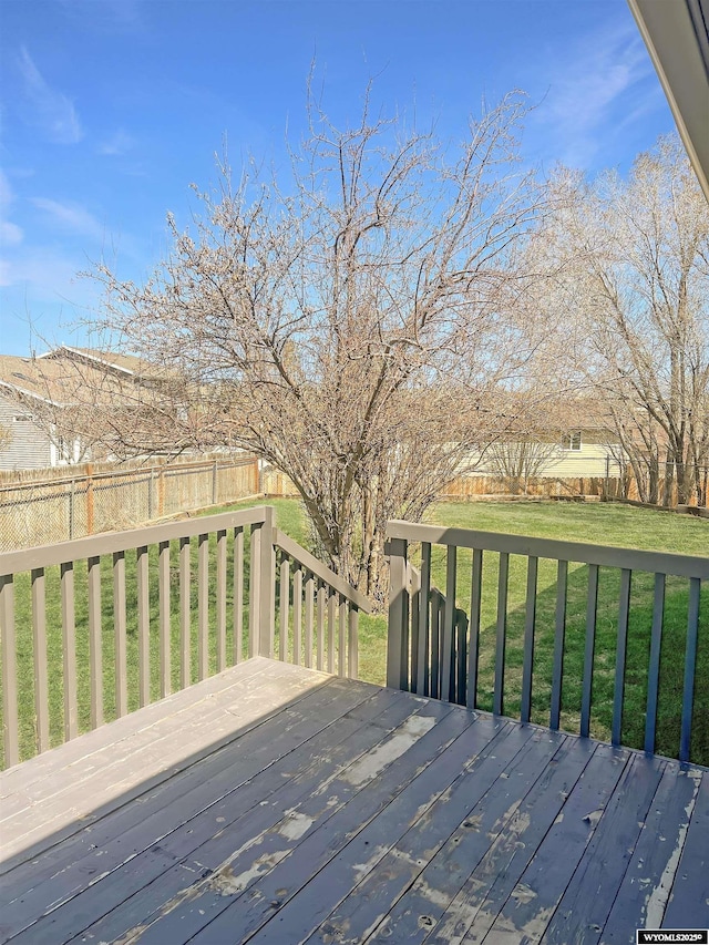336 Emerson Ave, Evanston, WY 82930 - deck featuring a lawn and a fenced backyard