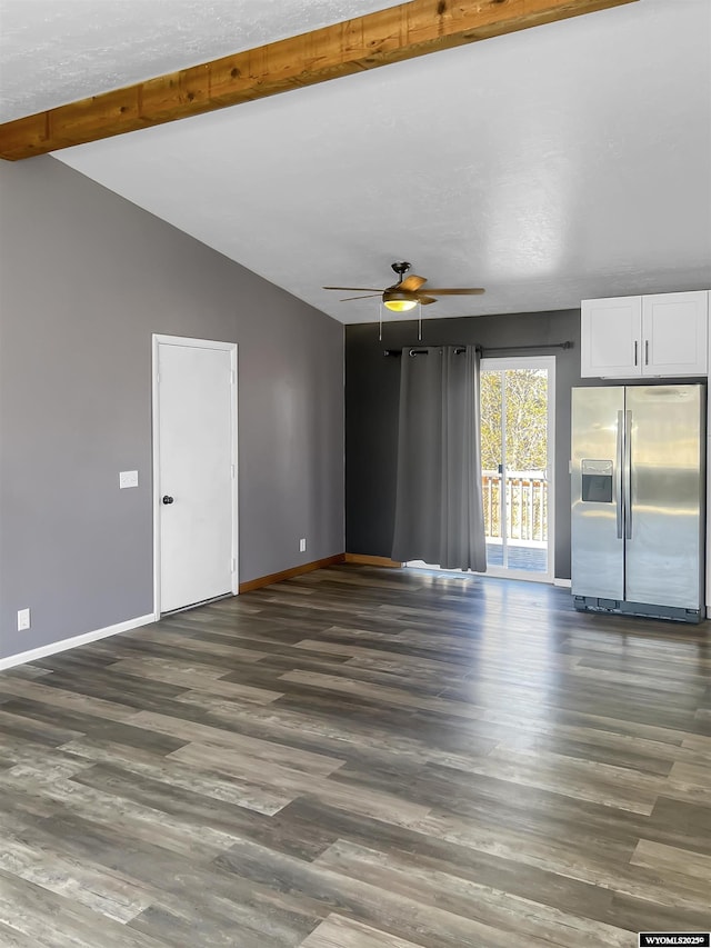 336 Emerson Ave, Evanston, WY 82930 - unfurnished living room with baseboards, lofted ceiling with beams, dark wood finished floors, and a ceiling fan