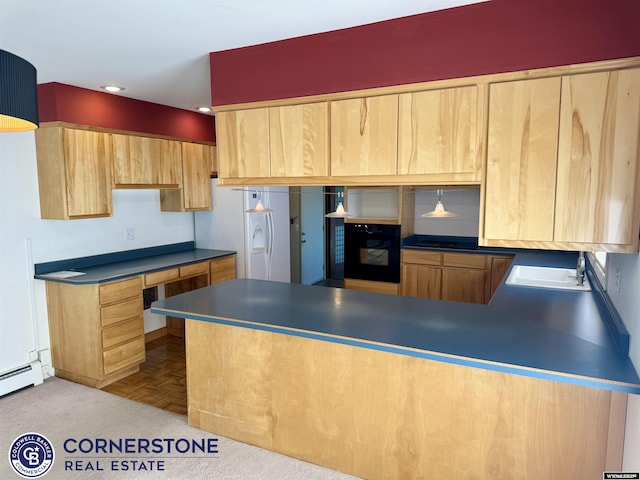 kitchen featuring a peninsula, light brown cabinets, recessed lighting, a sink, and black appliances