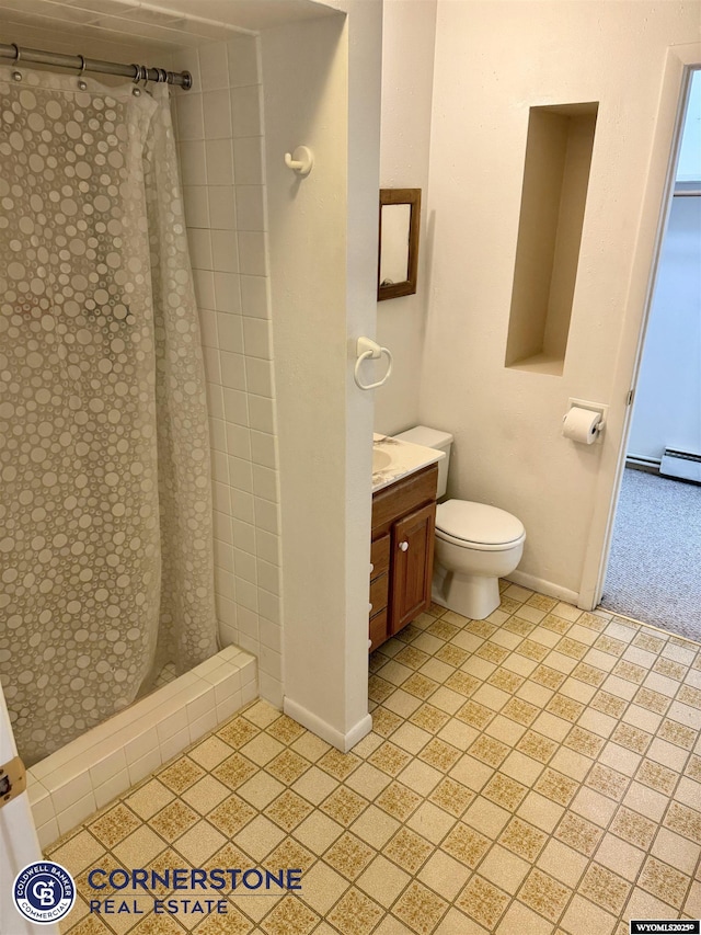 full bathroom with vanity, baseboards, a shower stall, and toilet