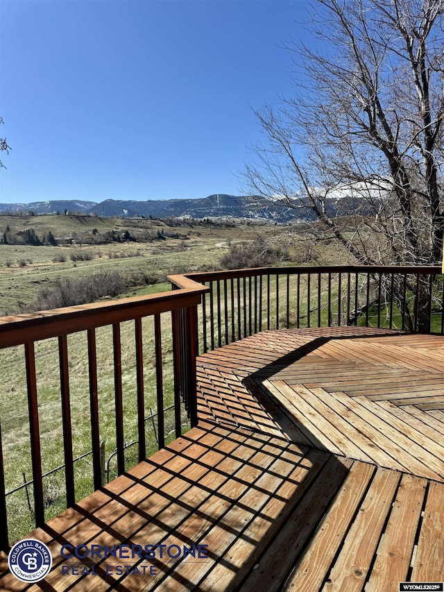 wooden deck featuring a mountain view