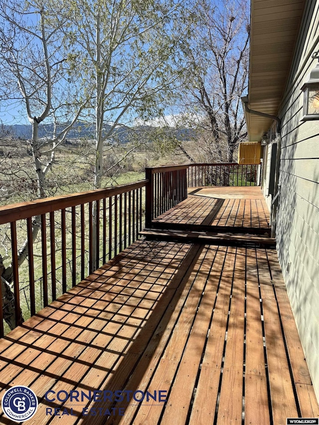 wooden deck featuring a mountain view