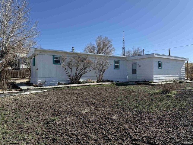 back of property featuring fence