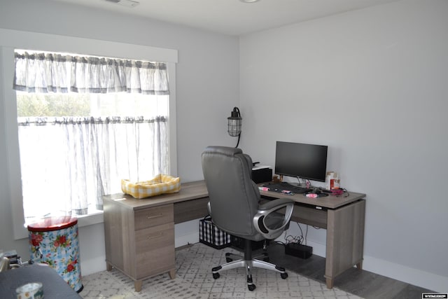 home office featuring baseboards and visible vents