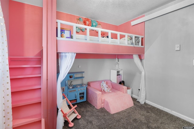 bedroom with carpet floors, a textured ceiling, and baseboards