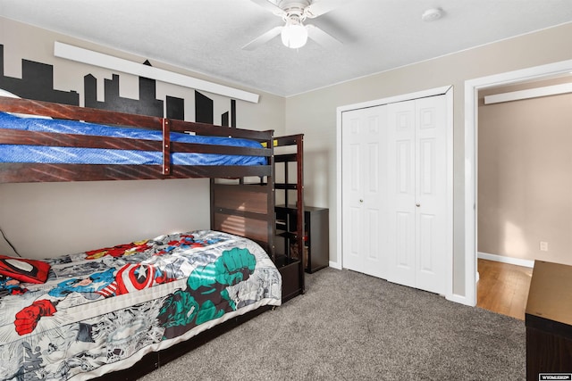 carpeted bedroom featuring a ceiling fan, baseboards, and a closet
