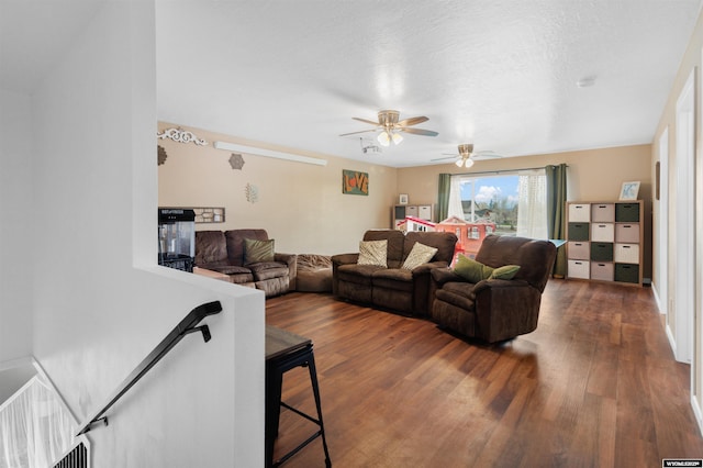 living room with ceiling fan and wood finished floors