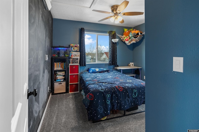bedroom with a ceiling fan and carpet flooring