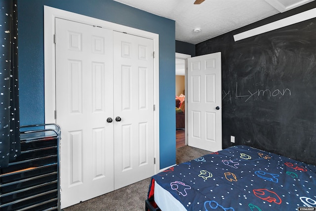 bedroom with carpet flooring, ceiling fan, and a closet