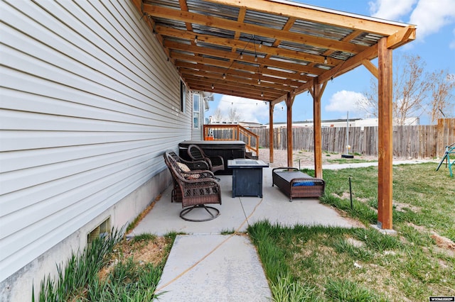 view of patio / terrace featuring a fire pit and fence