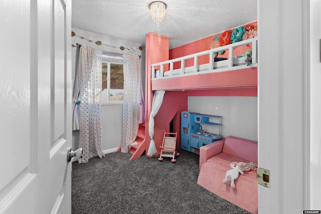 bedroom with carpet flooring and a textured ceiling