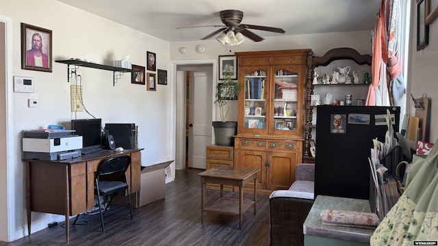 home office with ceiling fan, dark wood-style floors, and baseboards