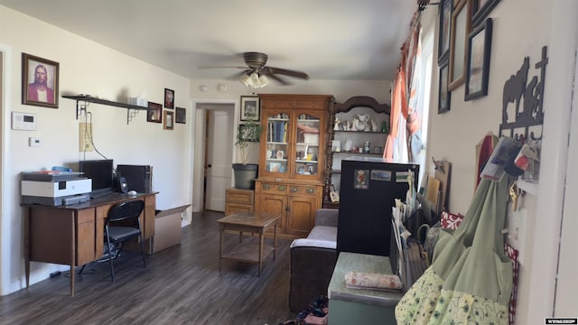 living room featuring a ceiling fan and dark wood finished floors