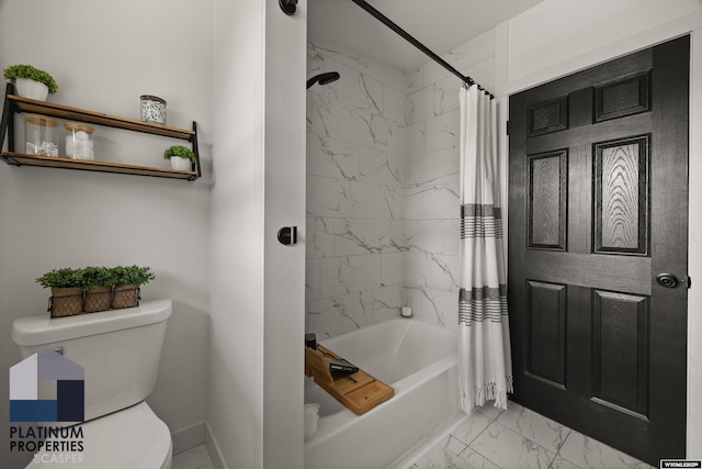 full bathroom featuring shower / tub combo with curtain, toilet, and marble finish floor