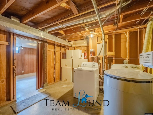 interior space featuring wooden walls, laundry area, and washer / dryer
