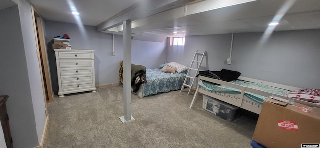 bedroom with baseboards and carpet