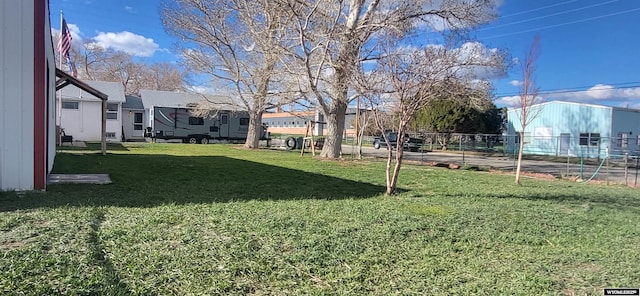 view of yard with fence and a residential view