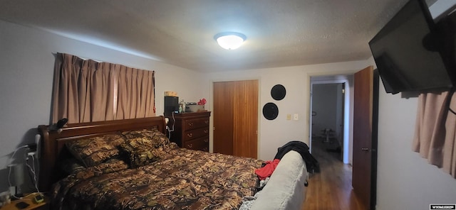 bedroom featuring wood finished floors