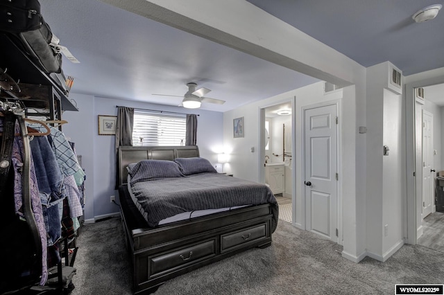 bedroom with visible vents, baseboards, carpet, and ensuite bath