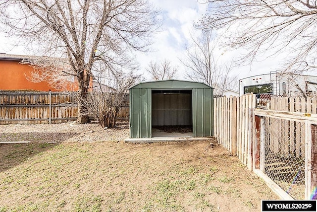 view of shed with a fenced backyard