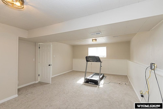 exercise room featuring visible vents and carpet