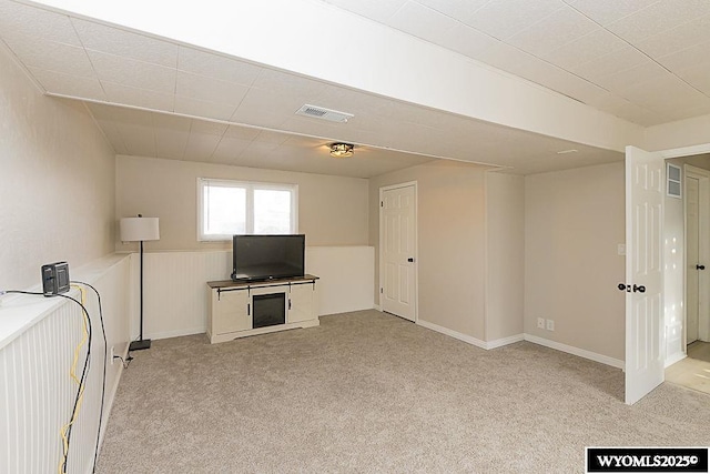 interior space featuring visible vents and light carpet