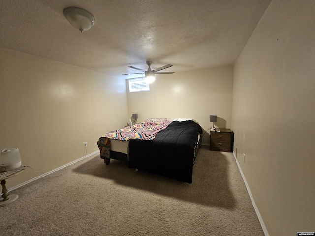 bedroom featuring carpet flooring, a ceiling fan, baseboards, and a textured ceiling